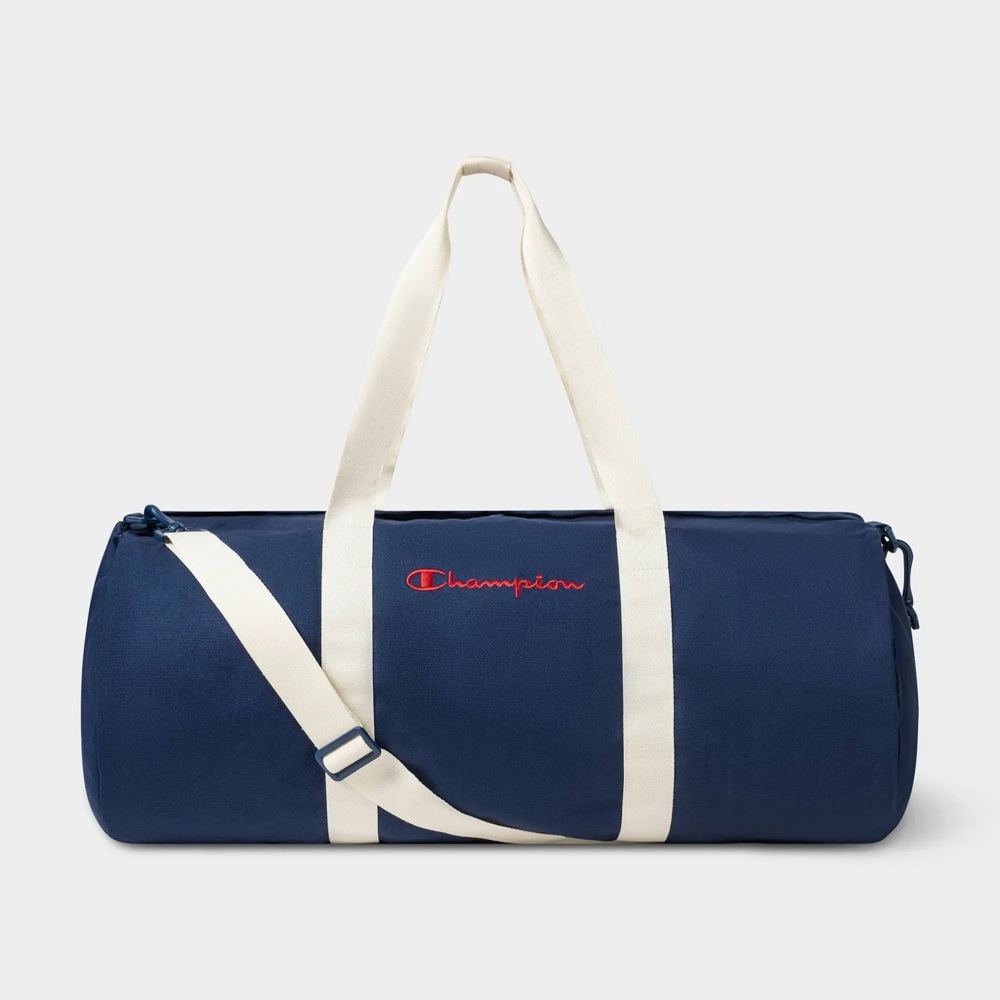 Champion duffel bag in navy blue with white straps and a red embroidered logo